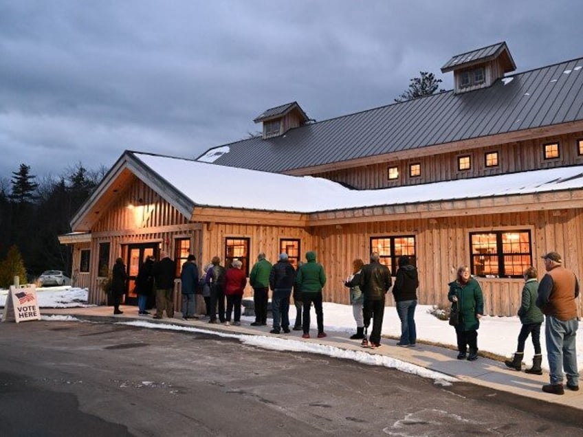 People wait in line for their polling location to open in order to cast their vote in the New Hampshire primary at the Barn at Bull Meadow on Tuesday, January 23, 2024, in Concord, New Hampshire. (Matt McClain/The Washington Post via Getty)