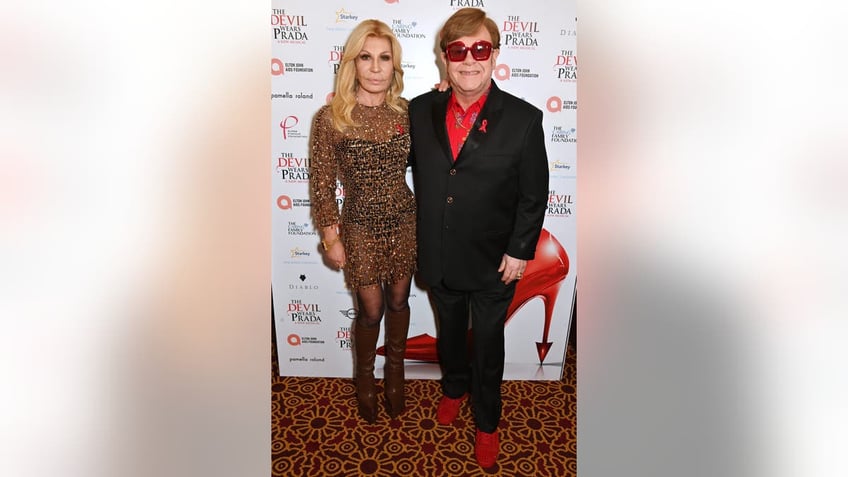 donatella versace with elton john at premiere