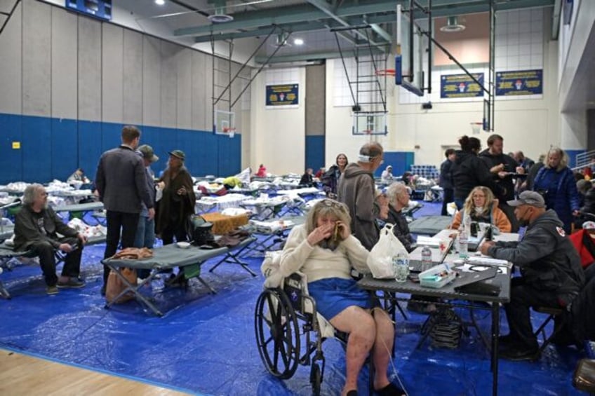 Evacuees from the Palisades Fire are seen at a shelter where donations have been pouring i