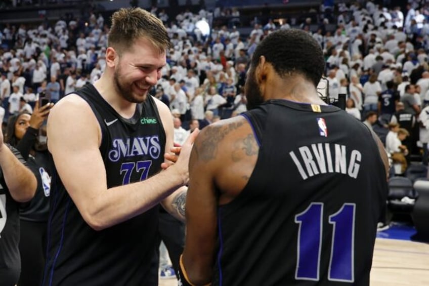 Dallas star Luka Doncic celebrates with Kyrie Irving after the Mavericks' victory over the