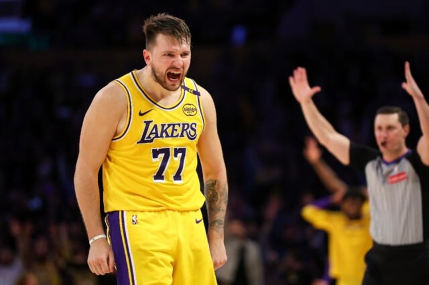 Luka Doncic reacts after making a three-pointer in the Los Angeles Lakers thrilling overti