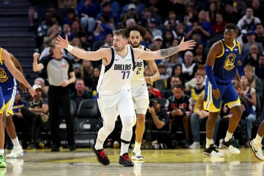 Dallas guard Luka Doncic, who shined with a triple double, reacts after the Mavericks made