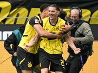 Dortmund complete escape act to snatch Champions League berth