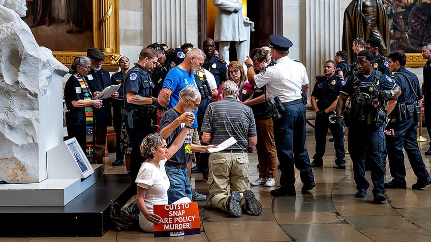 Capitol Police arrest demonstrators in Rotunda