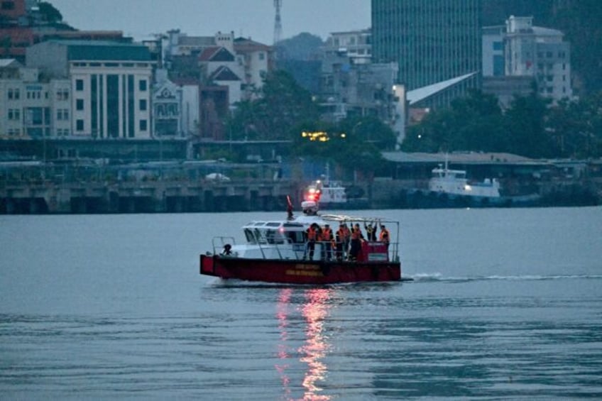 Rescuers are searching for five people still missing on Sunday after a boat capsized in Vi