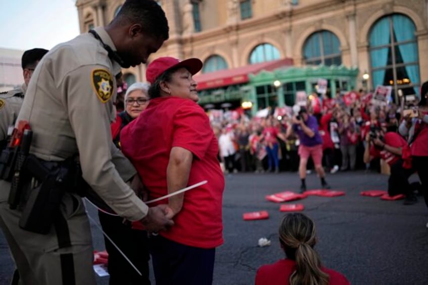 dozens of union workers arrested on las vegas strip for blocking traffic as thousands rally