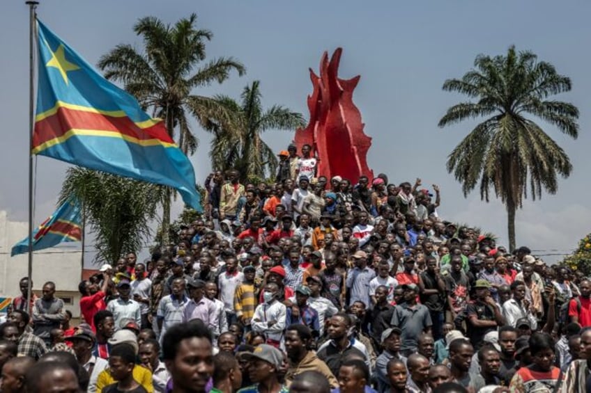 People in the eastern DR Congo city of Bukavu gather after a rally organised by civil soci