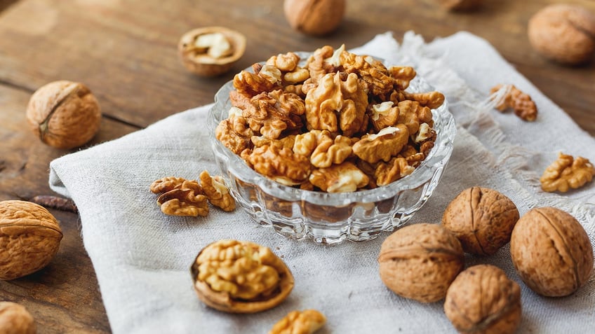 Glass bowl with walnuts