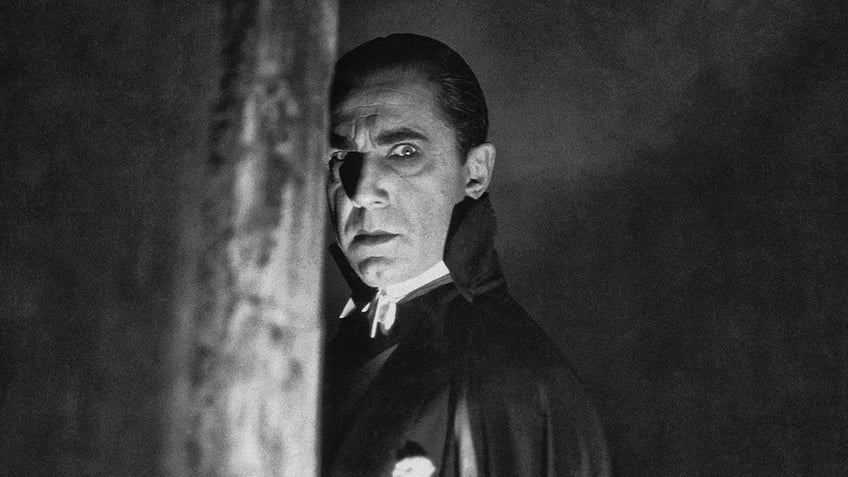 A close-up of Bela Lugosi looking to the side as Dracula.