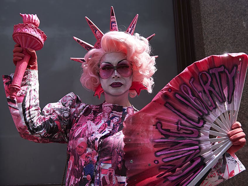 A drag queen joins protesters against the UK visit of US President Donald Trump as they ga