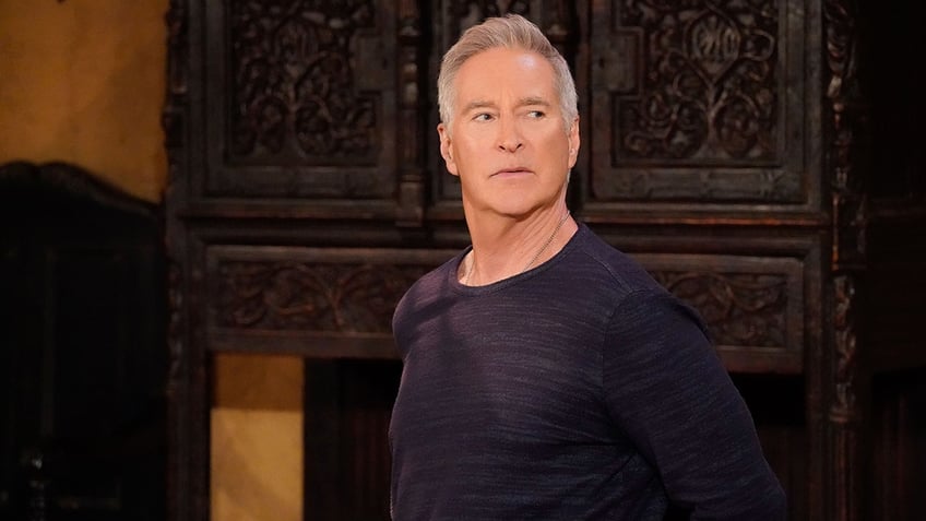 Drake Hogestyn as John Black looking to his left in a serious still from "Days of our LIves"