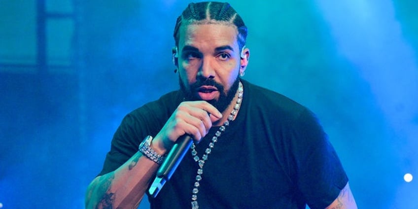 drake rushes to female fans aid as brawl breaks out after concert