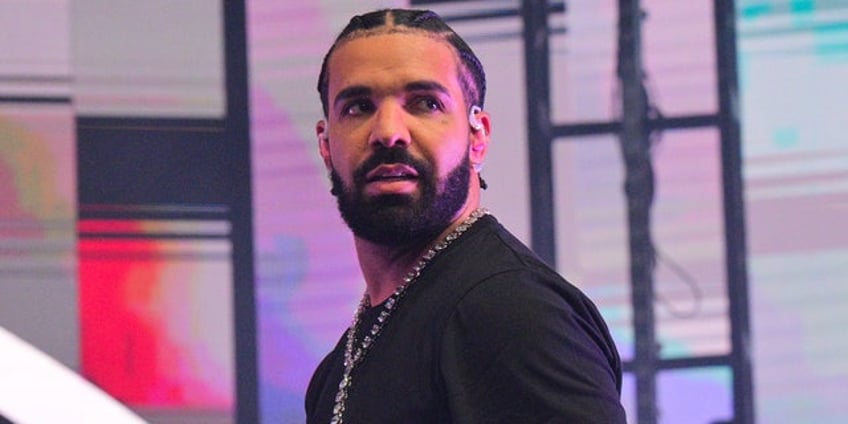 drake rushes to female fans aid as brawl breaks out after concert