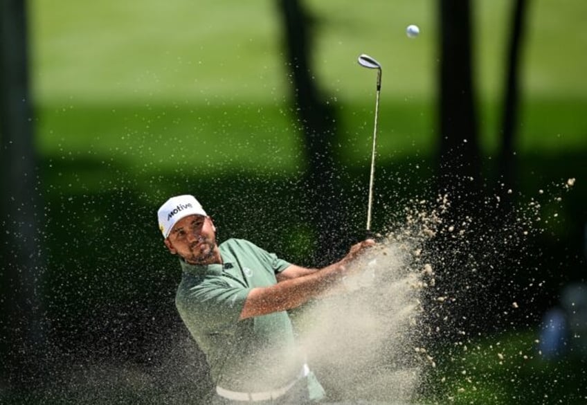 Australia's Jason Day blasts out of a bunker on the 11th hole at Valhalla in the final rou