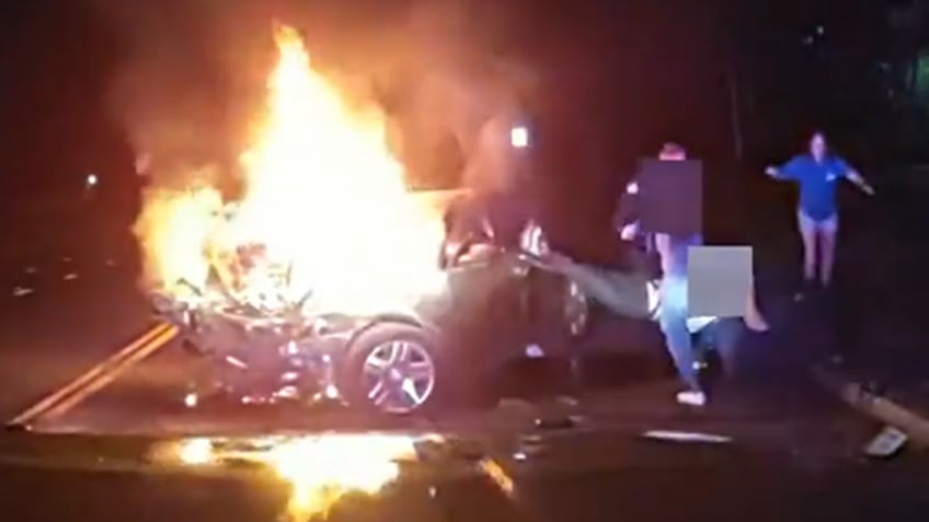 dramatic video shows colorado police officer helping save passenger from burning vehicle