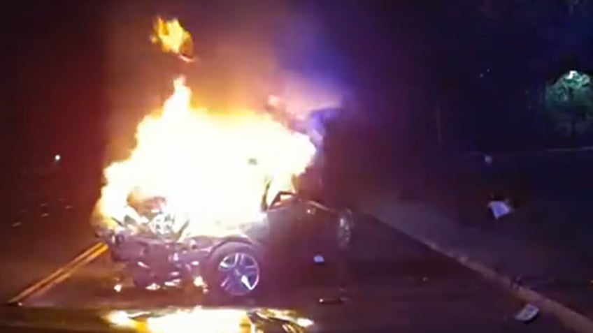 dramatic video shows colorado police officer helping save passenger from burning vehicle