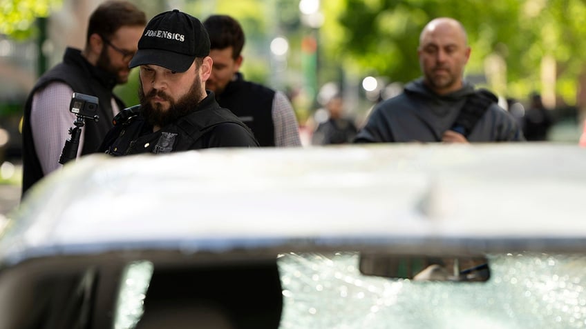 Police officers near the vehicle