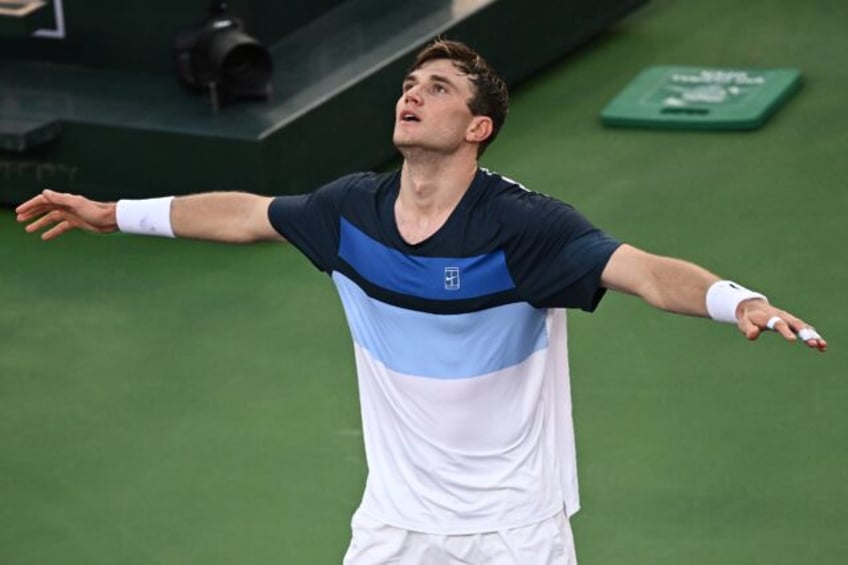 Britain's Jack Draper reacts after beating two-time defending champion Carlos Alcaraz in t