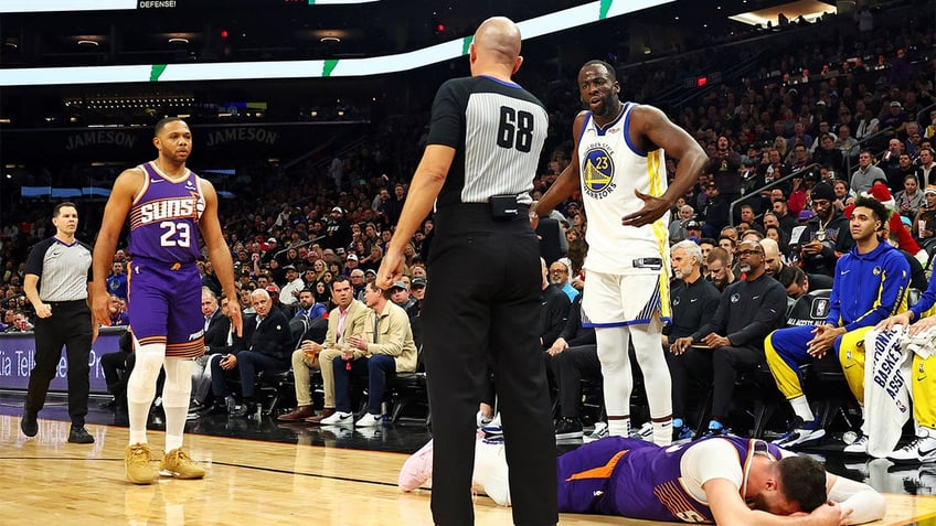 Draymond Green reacts after fouling Jusuf Nurkic