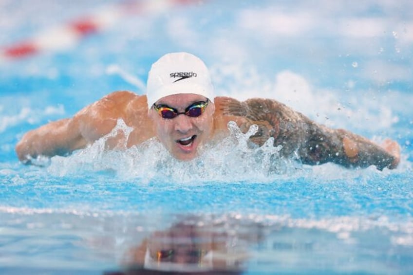 World record-holder Caeleb Dressel competes in the heats on the way to victory in the men