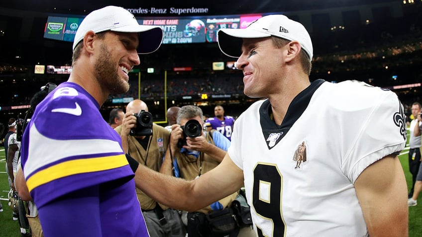 Drew Brees and Kirk Cousins at midfield