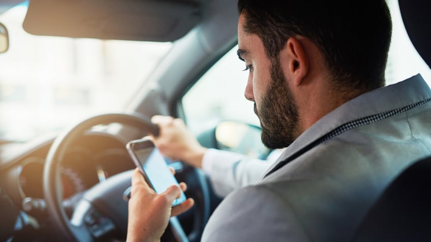 man texts and drives
