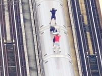 Drone surveillance catches kids in dangerous high-speed stunt atop moving subway train in New York City