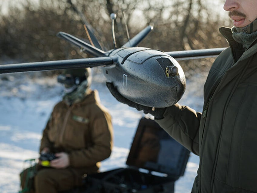 A soldier of Brigade 'Hetman Bohdan Khmelnytskyi' holds a Mriia 4.5.0 on March 16, 2025 in