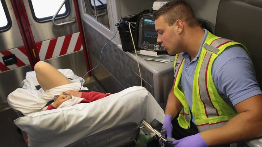 Overdose victim being treated by an emergency responder