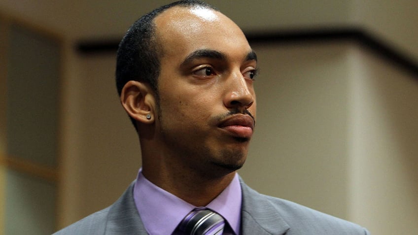 Shawn Turner in a grey suit looking to the side in court