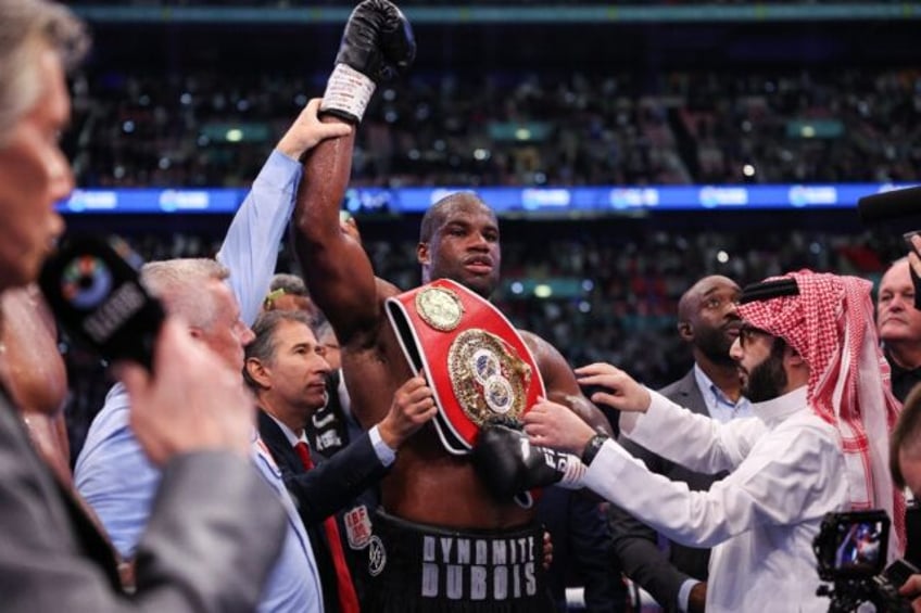 Britain's Daniel Dubois celebrates after defeating compatriot Anthony Joshua at Wembley to