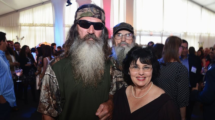 Phil Robertson posing with Kay Robertson