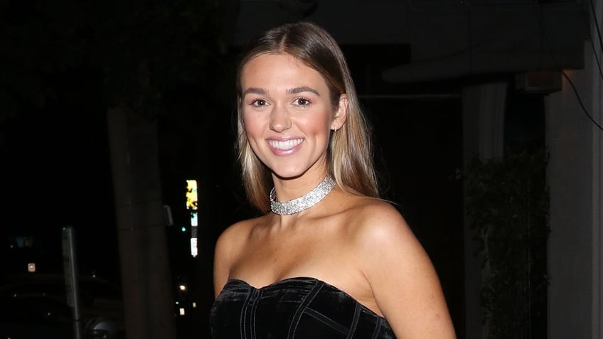 Reality star Sadie Robertson wears black strapless dress