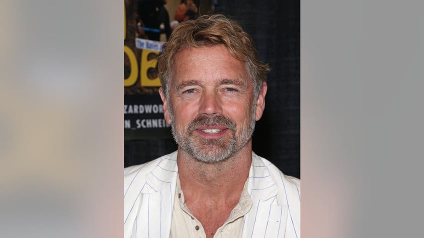 John Schneider smiling