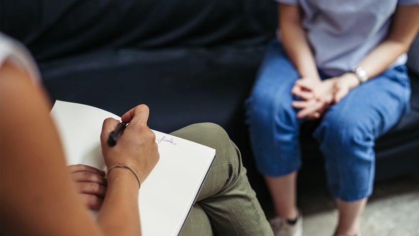 Psychiatrist meeting with a patient