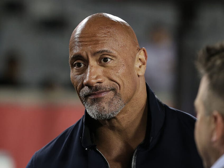 HOUSTON, TEXAS - FEBRUARY 18: XFL co-owner Dwayne "The Rock" Johnson make an app