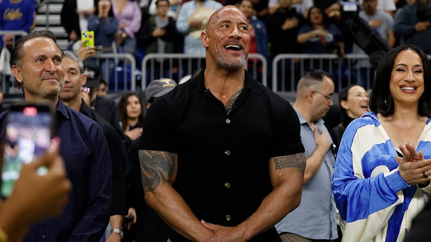 dwayne the rock johnson returns to wwe for first time since 2019 hits wrestler with peoples elbow