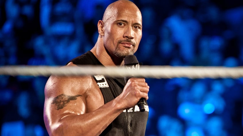 dwayne the rock johnson returns to wwe for first time since 2019 hits wrestler with peoples elbow