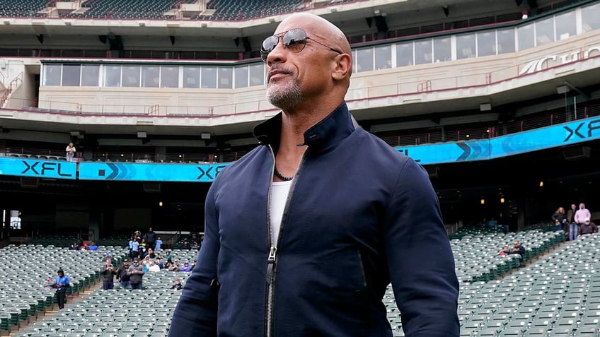 dwayne the rock johnson returns to wwe for first time since 2019 hits wrestler with peoples elbow