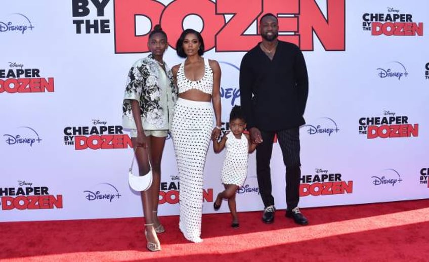 Actress Gabrielle Union and her husband former professional basketball player Dwyane Wade pose with daughters Zaya Wade and Kaavia James Union Wade...