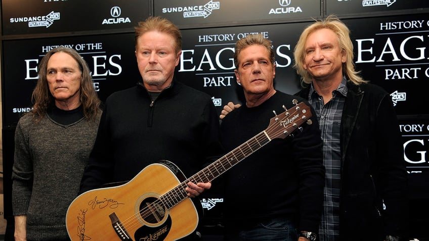 Members of The Eagles, from left, Timothy B. Schmit, Don Henley, Glenn Frey and Joe Walsh pose together