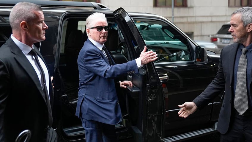 Don Henley getting out of a car outside of the courtroom