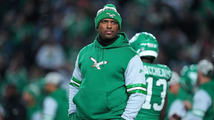 Eagles offensive coordinator Brian Johnson looks on during a game