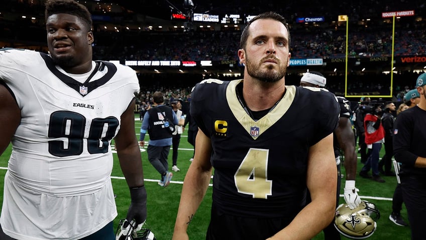 Derek Carr walks off the field