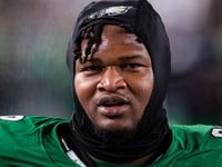 Eagles' Jalen Carter needs to be restrained as he trash talks Saints players, fans