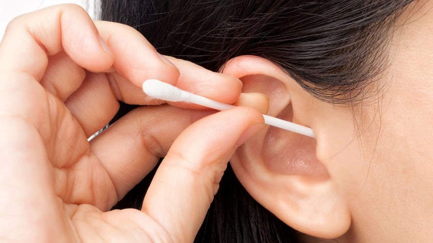 Woman Q-tip ear wax