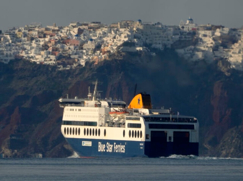 A regularly scheduled ferry departs from Santorini to Athens' port of Piraeus, after