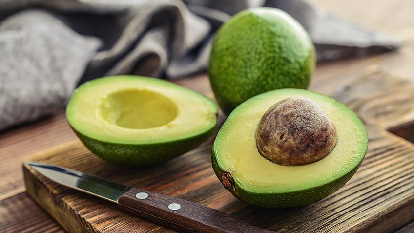 Sliced avocado on cutting board