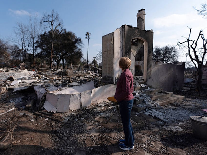 FILE - Louise Hamlin visits her home ravaged by the Eaton Fire in Altadena, Calif., Thursd