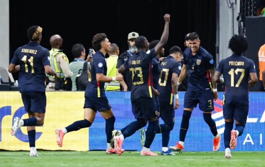 Ecuador players celebrate midfielder Kendry Paez's goal in their 3-1 win over Jamaica in t